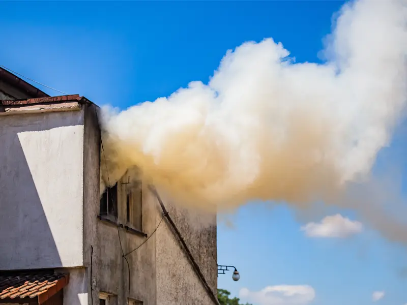 smoke coming out of home window